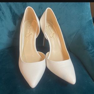 White Jessica Simpson pumps (heels that make him a simp)